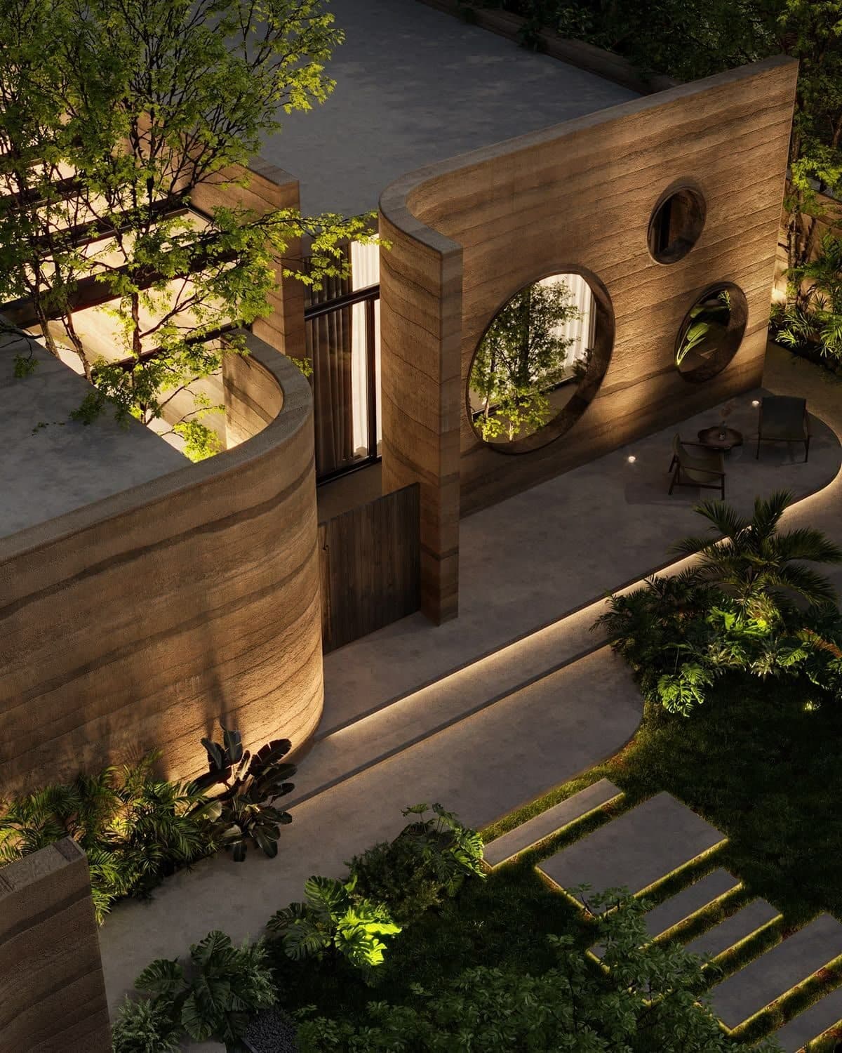 Sunken earthen courtyard with organic openings